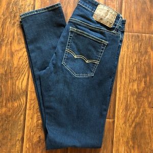 Dark distressed slim fit jeans